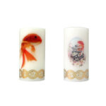 Bougies de Nowruz avec calligraphie et poissons décoratifs