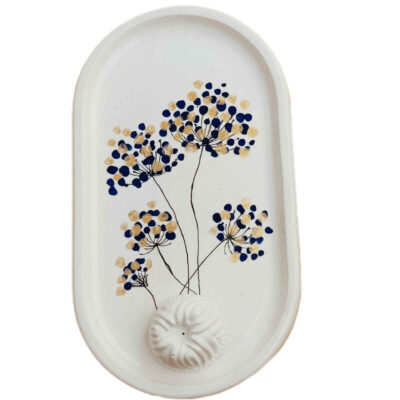 Plateau de service en béton artisanal avec motif de pissenlit pour décoration intérieure