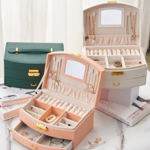 Boîte à bijoux avec rangement à plusieurs niveaux, miroir et serrure pour des accessoires bien organisés
