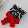 Belle et attachante broche raton laveur perlée