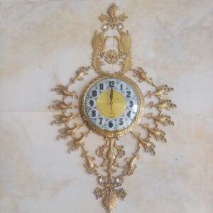 Horloge murale en laiton élégante et intemporelle avec motif oiseau en losange
