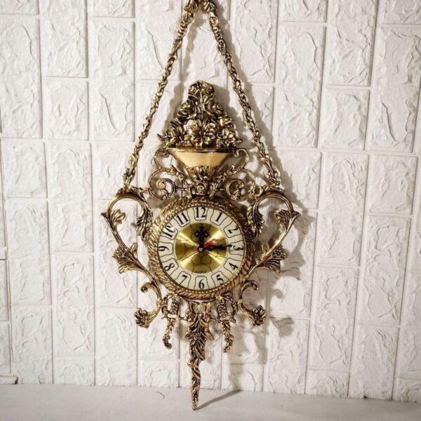 Grande horloge murale suspendue en laiton avec pendentif floral